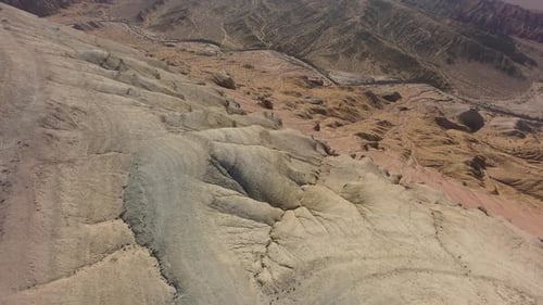 Exploring Colorful Sandstone Formations in a Vast Desert Landscape