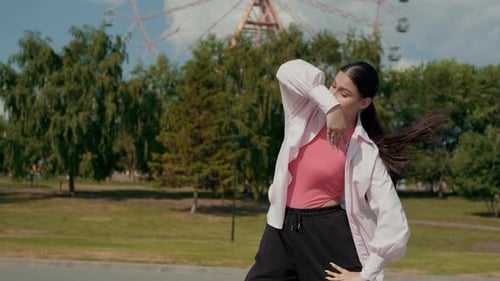 Girl Dancer Dancing Energetic Dance on the Street in Urban Atmosphere