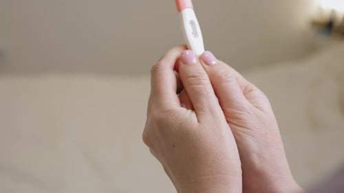 Woman Holding in Hands Pregnancy Test Check Quick Pregnancy Test Kit