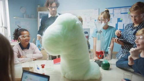 Elementary School Science / Chemistry Classroom: Enthusiastic Teacher Shows Funny Chemical Reaction