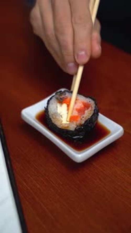 Tempura sushi roll with cuttlefish ink