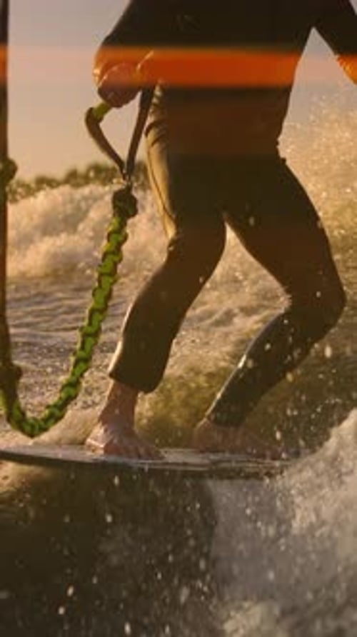 Barefoot Water Sport Wakeboarding On Wake Behind Boat