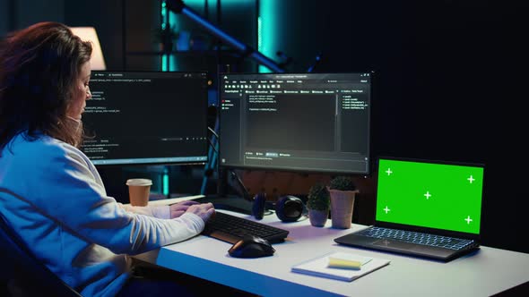 Programmer Using Green Screen Laptop to Secure Company Servers ...