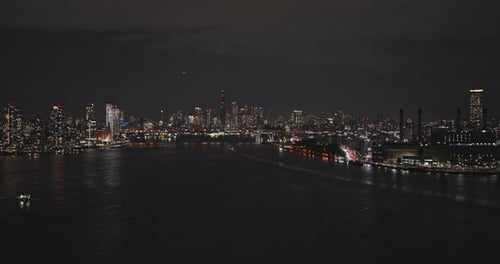 NYC New York Aerial v177 drone flyover East river, panning views capturing illuminated skyscrapers c
