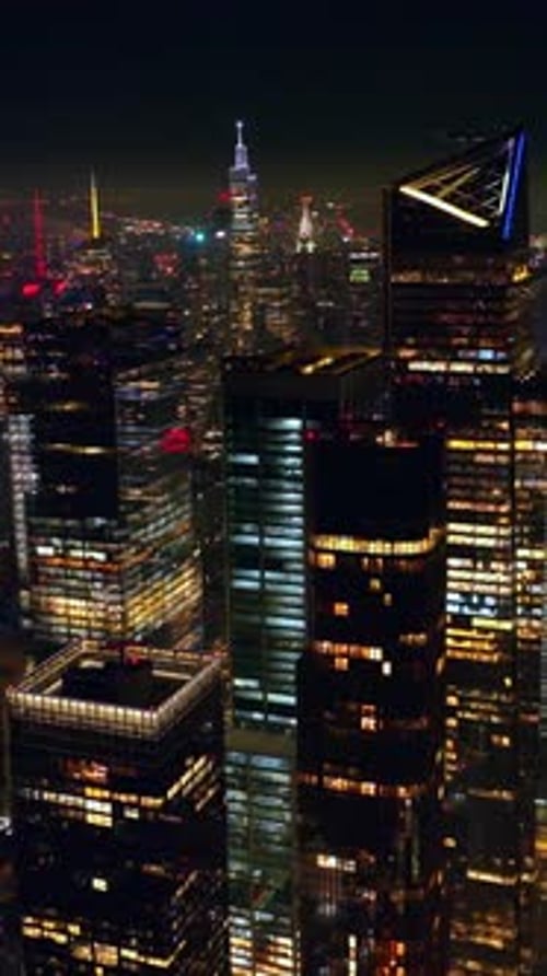 Colorful diverse lights of nighttime New York. Crazy traffic flow around the streets of metropolis