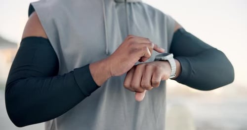 Man Using Smartwatch for Fitness Tracking Outdoors