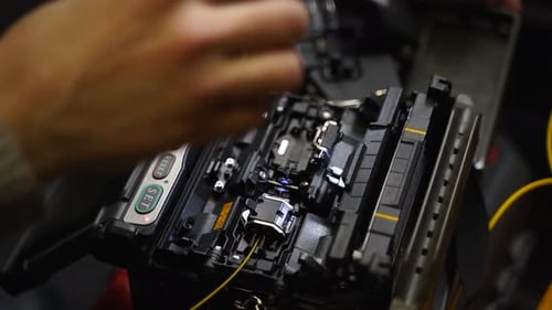 Fiber Optic Cable Being Placed into Machine
