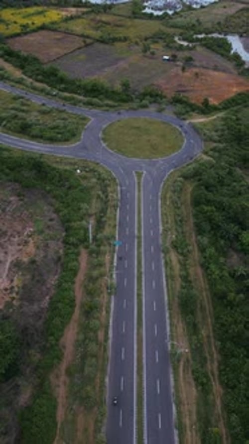 Lonely Asphalt Trail Traversing Open Areas And Natural Vegetation