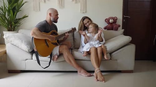 Loving Family Enjoys Music Together at Home