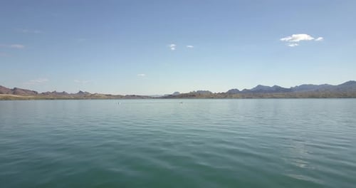Kayakers In Lake With Mountains 4k