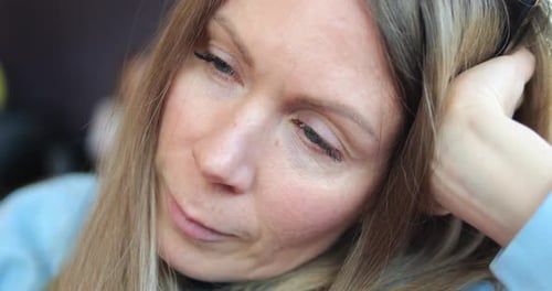 Woman Sitting Still with Eyes Closed Close Up