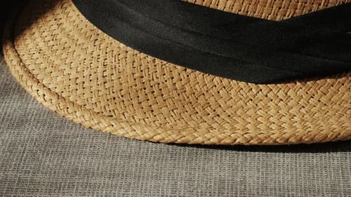 Close Up of Woven Straw Hat With Black Band