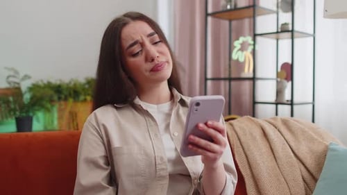 Woman Reacts to Bad News on Cell Phone