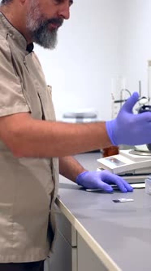 Scientist Performing Experiment in Lab with Pipette