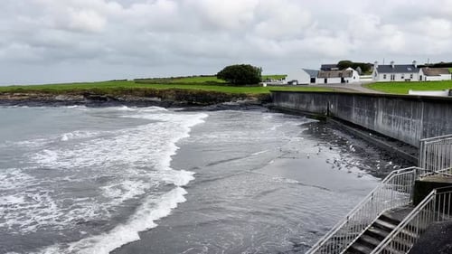 Strong waves on the beach in Ireland west coast - seagulls on the beach - Irish landscape in the bac