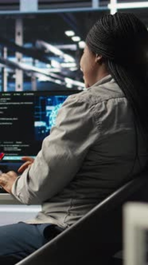 Vertical Video Data Center Employee Deploying AI Solutions Optimizing Equipment