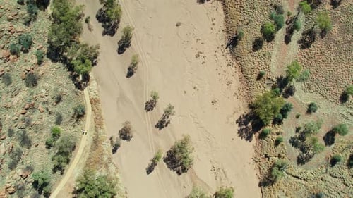 Drone view looking down on the dry river bed of the Todd River, north of Alice Springs, Mparntwe, No