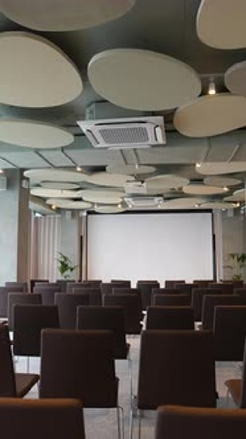 Empty Conference Room with Screen and Projector