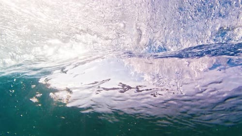 Crystal Clear Wave Breaks in the Ocean on the Maldivian Shore