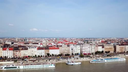 Aerial footage of Budapest, Hungary over the Danube river on a summer's day