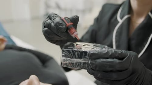 Cosmetics Artist Preparing for Microblading Procedure