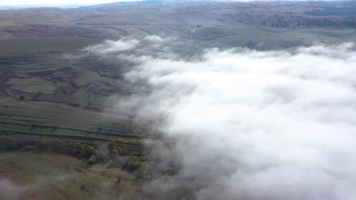 Aerial View of Autumn Clouds Above Countryside Pasture