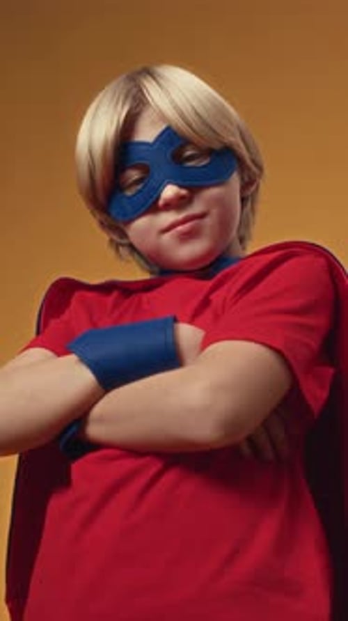 Child Dressed As a Superhero Smiles