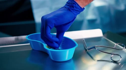 Close-up shot of sterilized scalpels and other metal instruments for surgery on table in an room