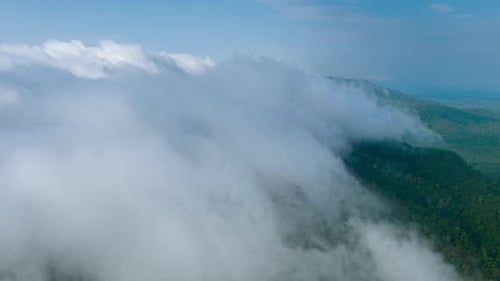 Aerial view morning scenery Mist flowing over the high mountains.