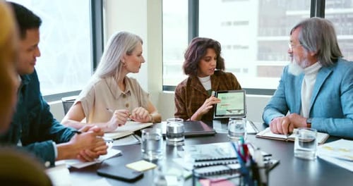 Business people, tablet and teamwork for planning, strategy and ideas by desk in modern office