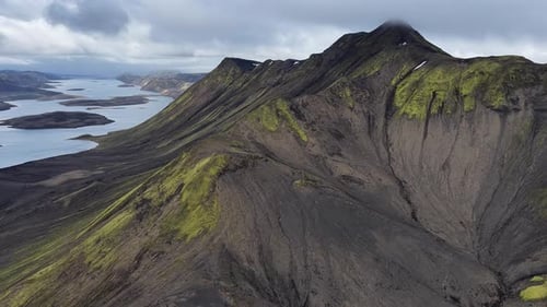 Aerial View of Iceland's Volcanic Mountains and Winding Waterways