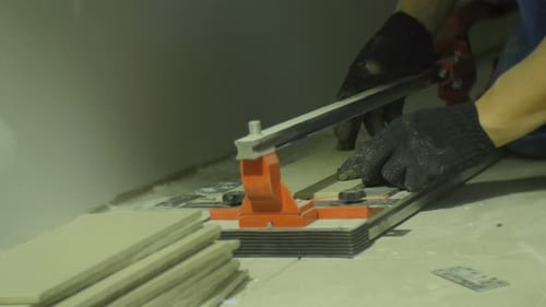 Tile Cutter Scoring Long Tiles Carefully Indoors