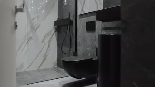 Modern bathroom interior with black and gray marble