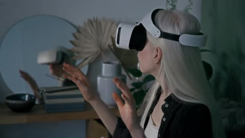 Woman Uses Virtual Reality Headset at Home