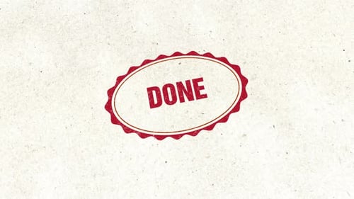 Red Done Stamp Approval Mark on Textured Paper