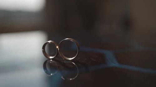 Close Up of Gold Wedding Rings Reflecting
