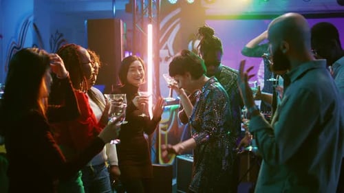 Young Adults Toasting at Nightclub Celebration