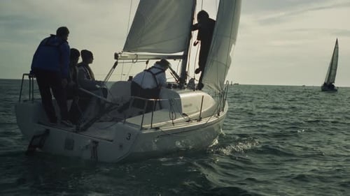 A Sports Floating Yacht with a Team on Board A Regatta or a Race The Ship's Crew Controls the Sail