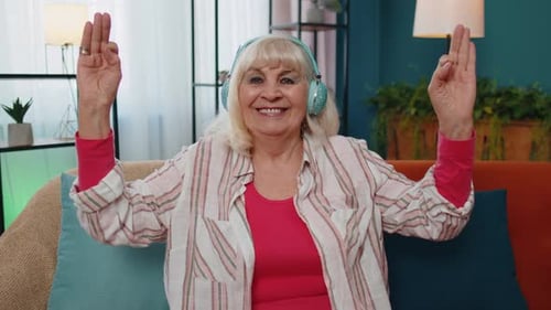 Relaxed Senior Woman Doing Stretching Exercise at Home