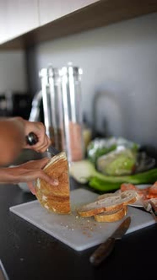 Close Up of Slicing Bread in Home Kitchen