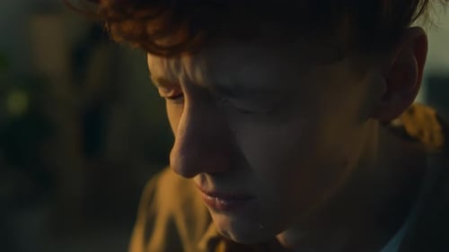 Tearful Young Adult Crying in the Dark