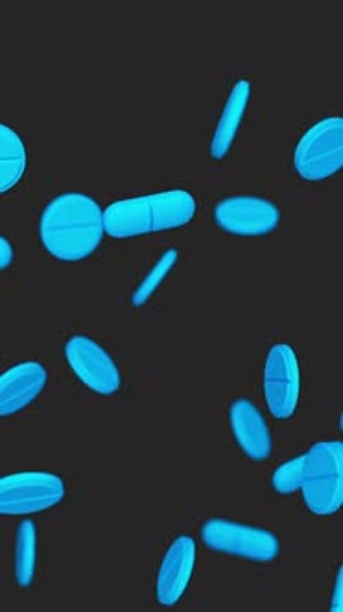 Falling Blue Pills on Dark Background for Medical Content