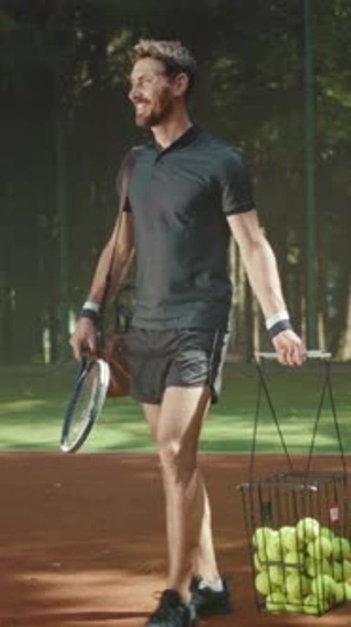 Man and Woman Walk on Tennis Court