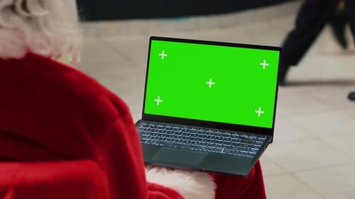 Santa Holding Green Screen Laptop