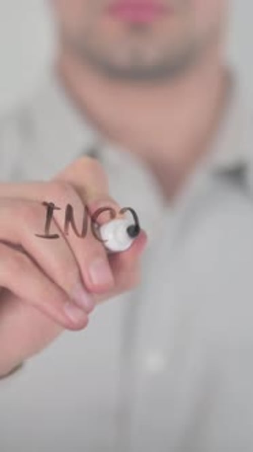 Man Writes Income Inequality on Glass Surface