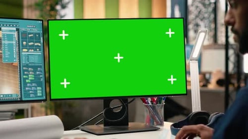 Property Developer Reviewing Architectural Blueprints with Green Screen