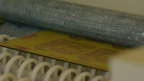 Printed circuit board moving on conveyor belt in electronics factory