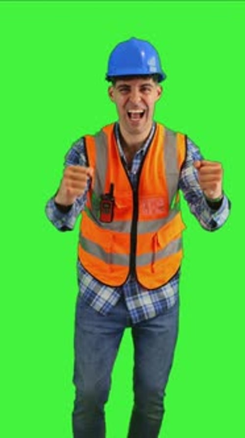 Construction Worker Celebrates Achievement on Green Screen