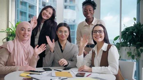 Diverse Group of Young Women Waving at Camera