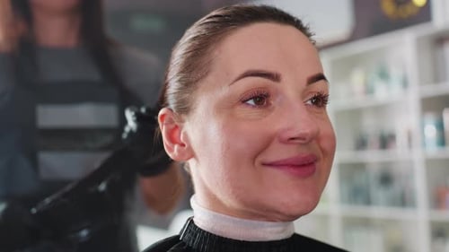 Peaceful Individual Enjoys Soothing Hair Conditioning Session Serene Person Reclines with Eyes Shut